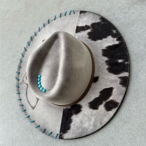 Beige cow print rancher style cowboy hat distressed